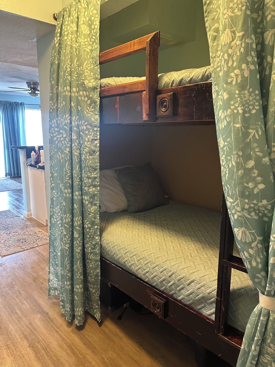 Twin bunk beds with privacy curtains