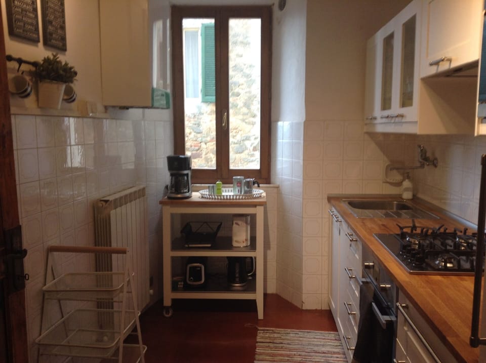 New kitchen with gas cooktop, oven, microwave and full-size refrigerator/freezer