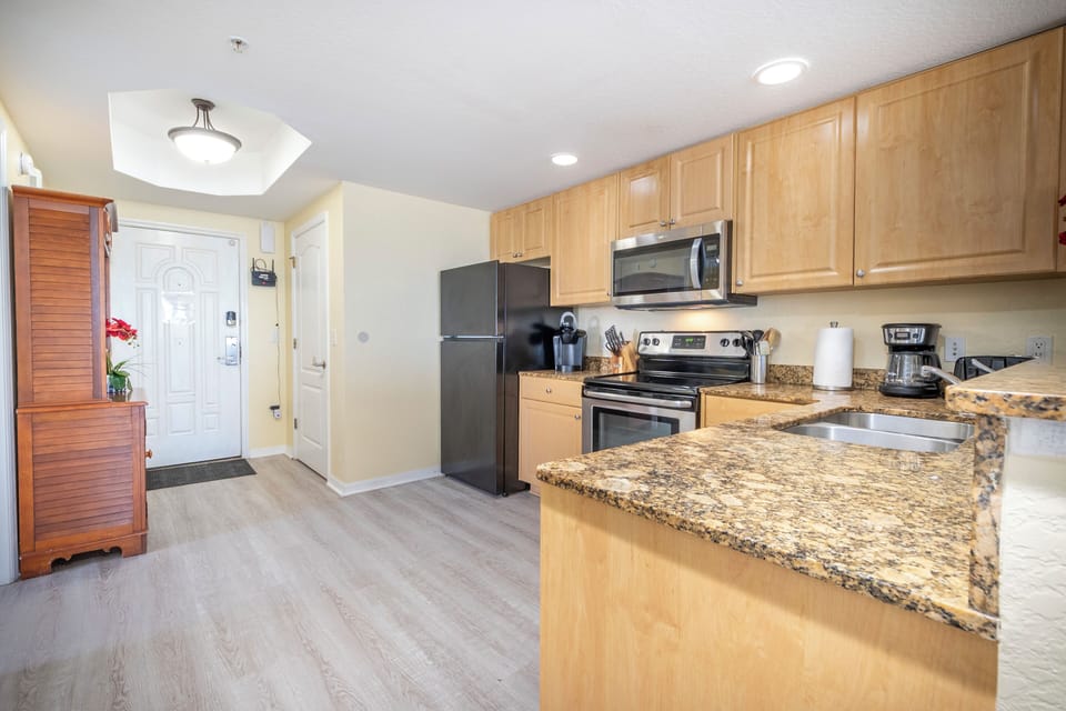 Full kitchen: refrigerator, dishwasher, stove/oven, microwave, coffee makers. 