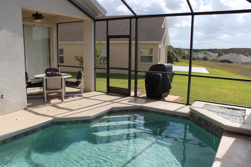 Pool and Lanai with Gas Grill.