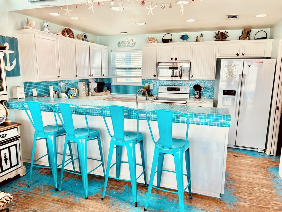 Modern barstools, designer tile, and all the comforts of Home in our kitchen!