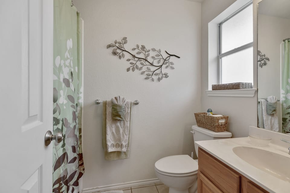 baths are stocked with toilet paper, hand soap, shower gel, and 2&1