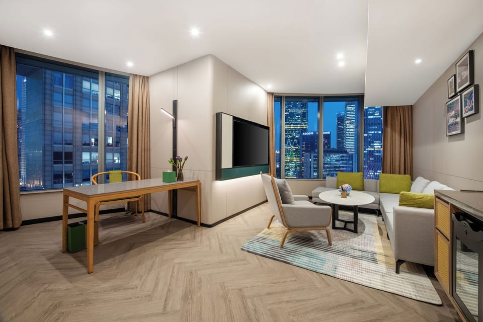 Suite, 1 Bedroom (IFC Tower View) | Living area | 50-inch flat-screen TV with cable channels, TV, pay movies