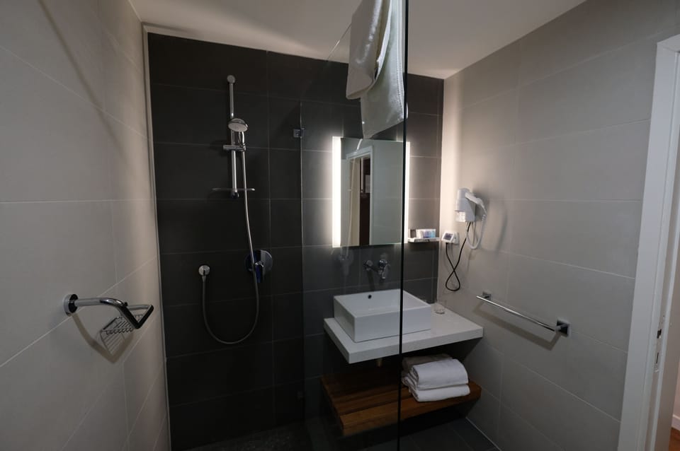 Suite, Balcony, City View | Bathroom | Shower, free toiletries, hair dryer, towels