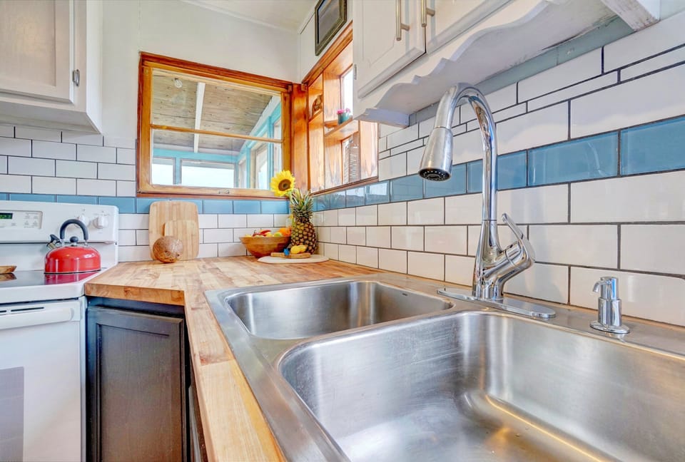 Kitchen w/ Butchers Block Top and Tile Splash 