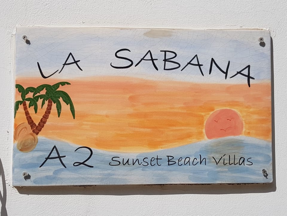 Sign by front door
