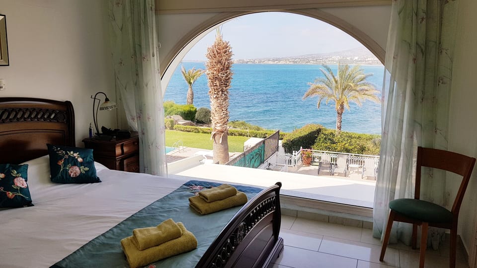 The main bedroom with a massive glass window