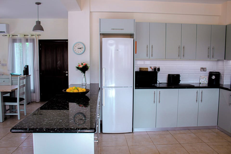 Bright and airy open plan Kitchen / Dining area with full aircon. 