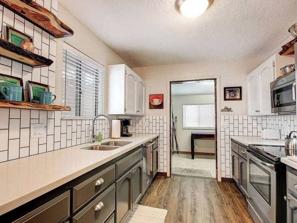 Quartz Countertops, High-End German Faucets and Stainless Steel Appliances