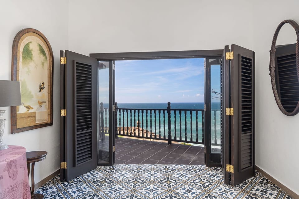 View from the master bed, view to historic guard's house and to the ocean.