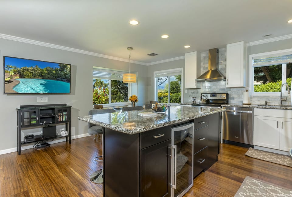 Granite island with bar seats and open concept