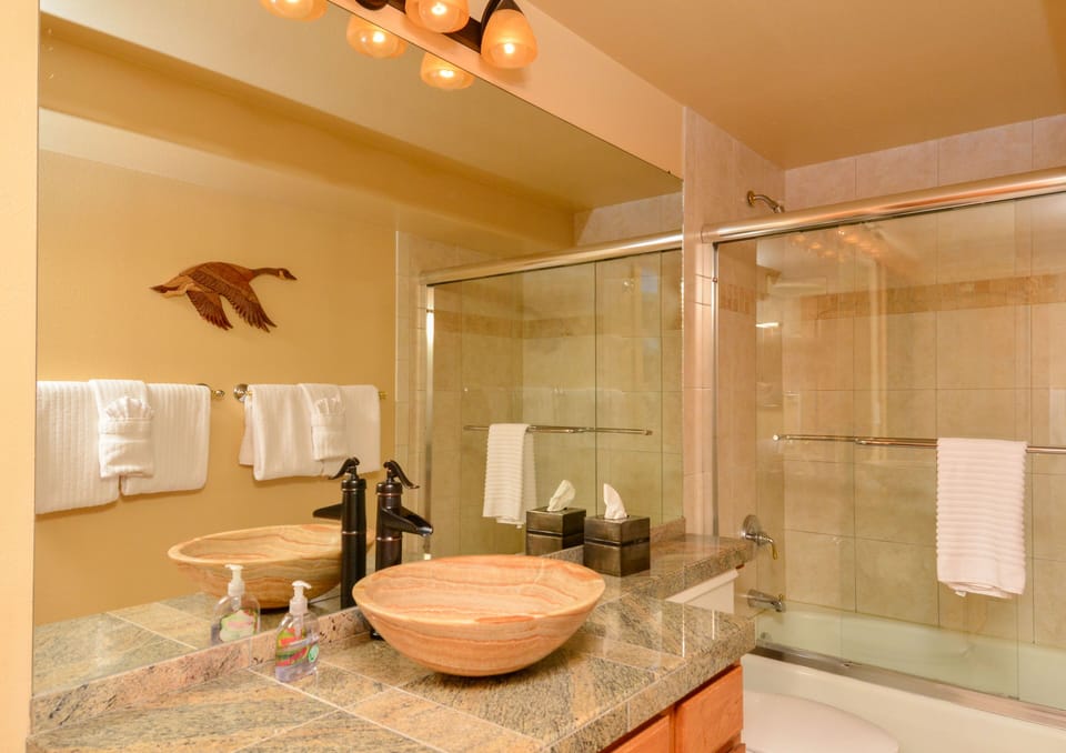 Updated bathroom with vessel sink, granite counters. 