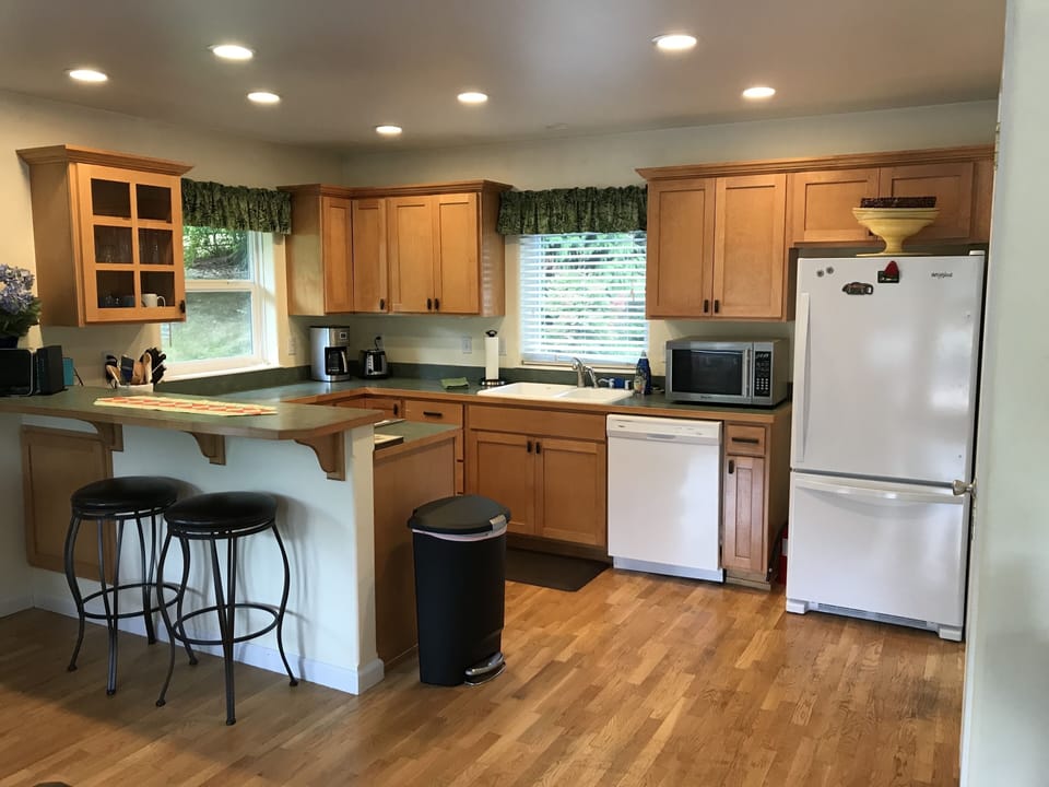Kitchen has full-sized appliances and ample counter space.
