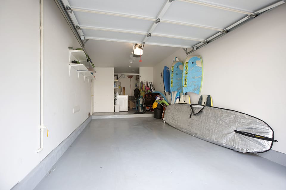 Garage w/alot Toys, surf board, boogie boards , umbrellas and chairs, stroller.