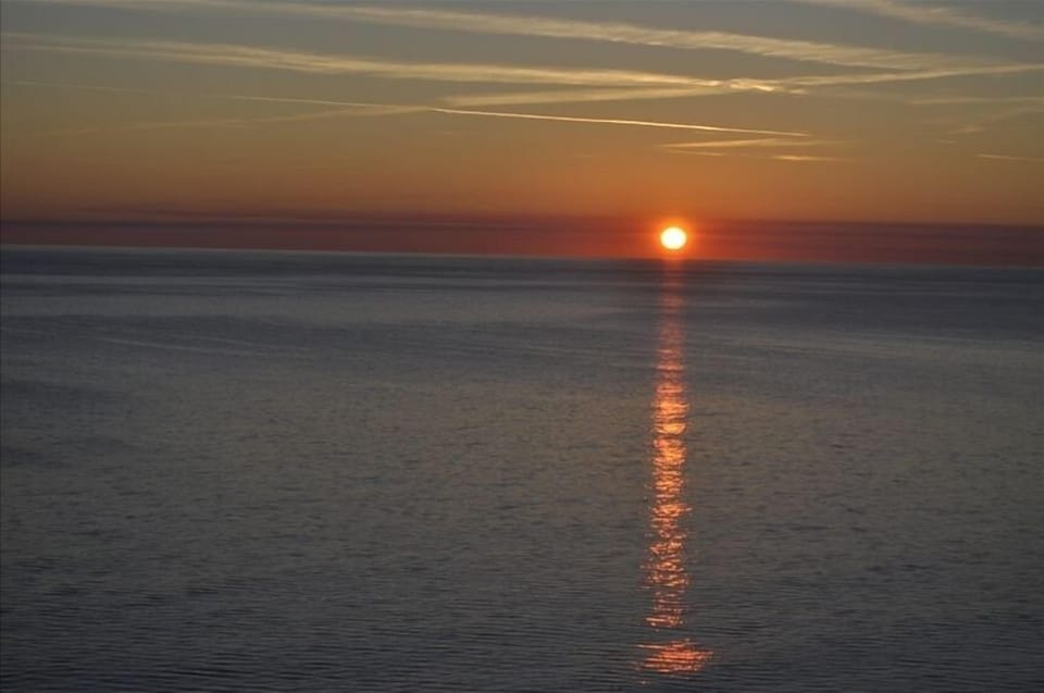 Enjoy Sunsets from either of the Balconies in this Top Floor Penthouse