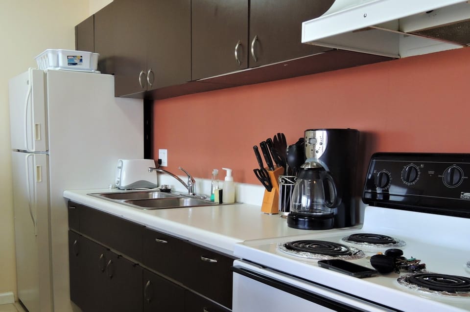 Kitchen with Full Size fridge, stove, and oven