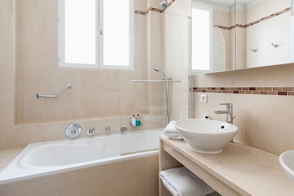 Enjoy a long hot soak in the bathtub at the end of the day in bathroom 1.