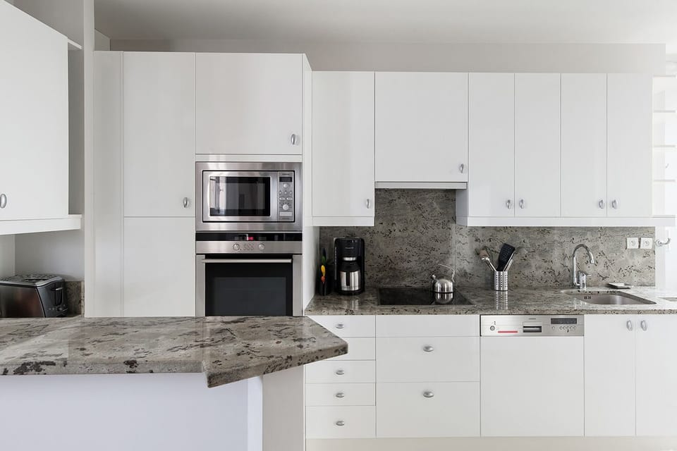 Fully equipped kitchen with modern appliances.
