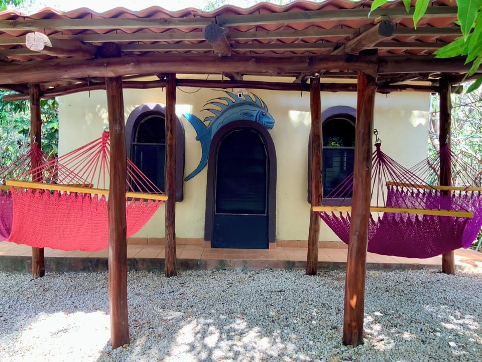 Relax in oversized hammocks under your shaded rancho