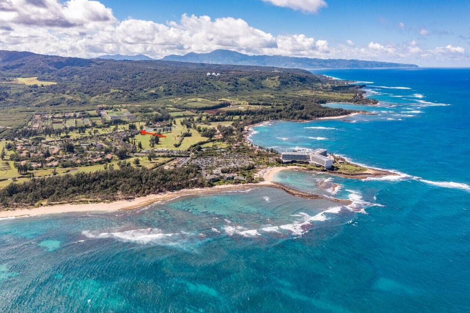 Scenic coastline carved by blue waters & rugged shorelines.