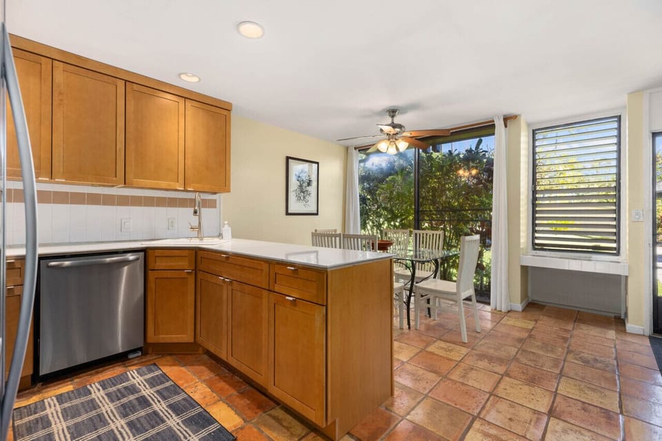 Kitchen corner opening to the outdoors for easy meal flow.