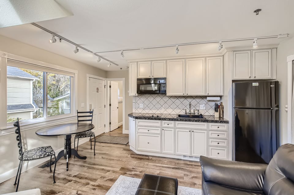 Kitchenette includes 2-burner stovetop, microwave, refrigerator, and more.