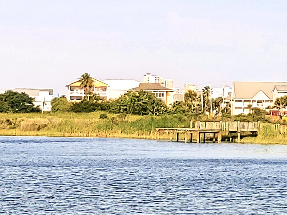 View of house with public fishing pier.