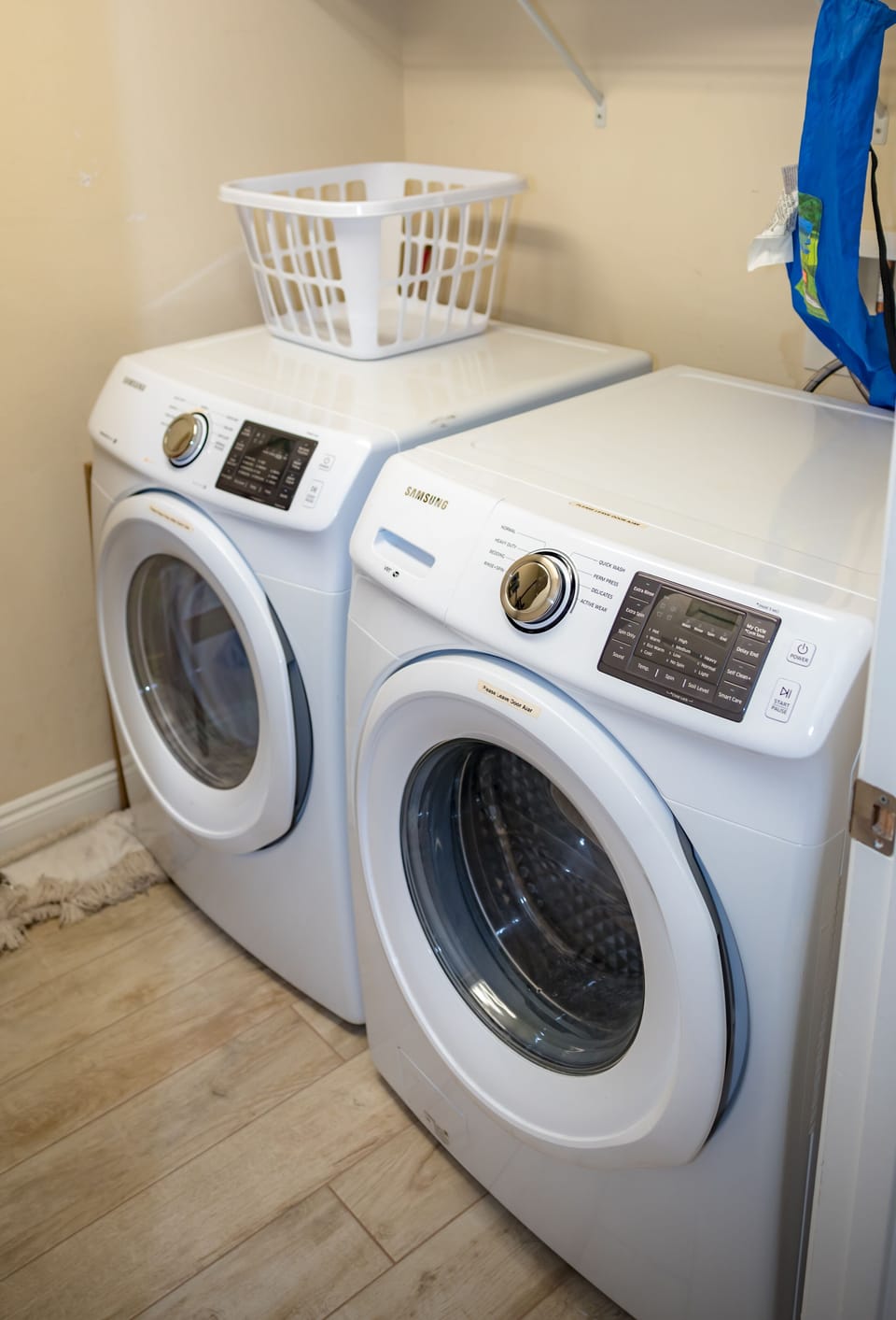 Laundry room with full-size washer/dryer...