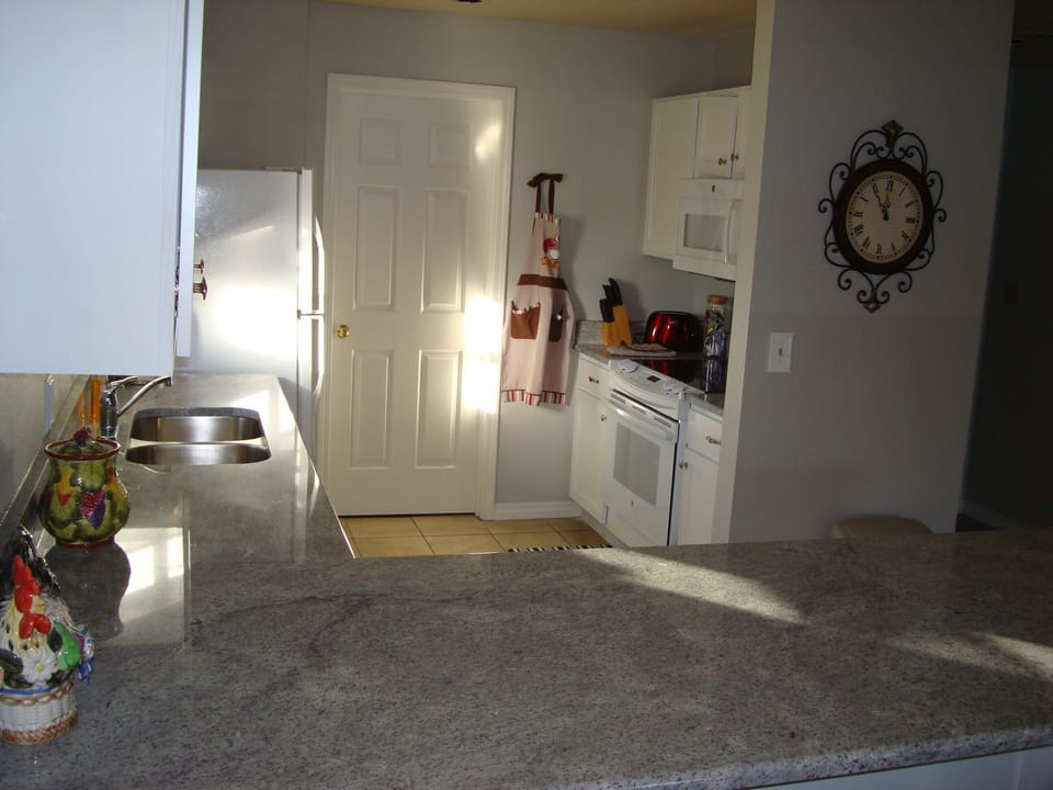 Full size laundry room off kitchen, separated by door to seclude noise