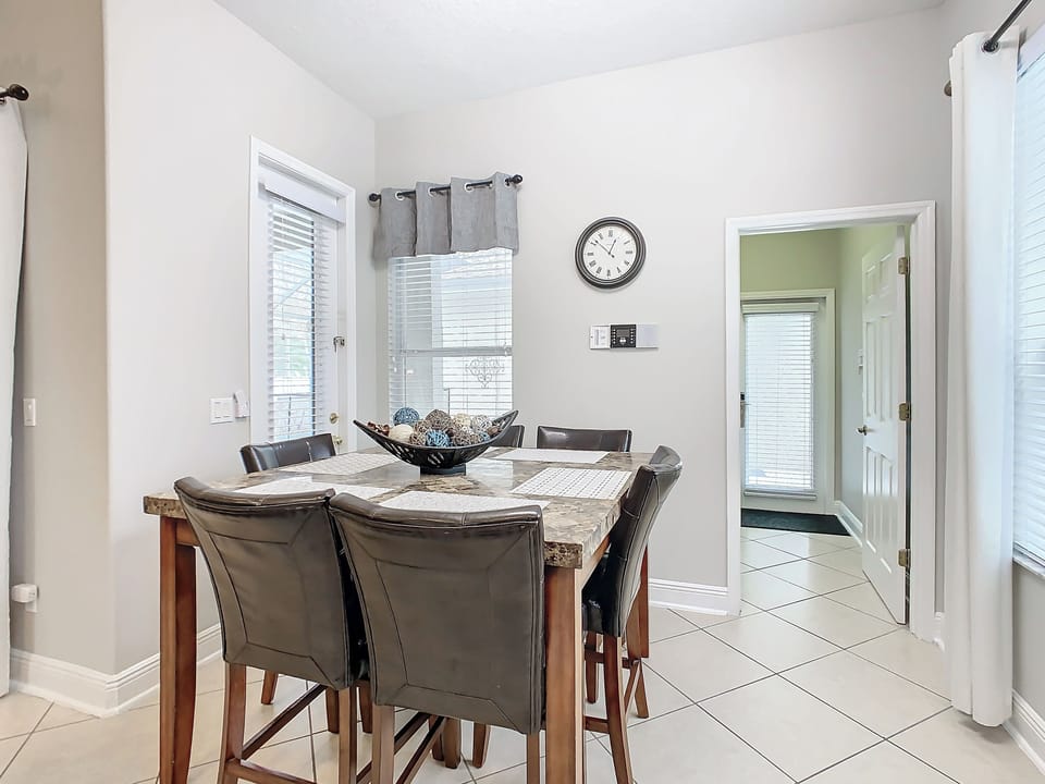 kitchen nook table - entry to utility room , and leads to garage.