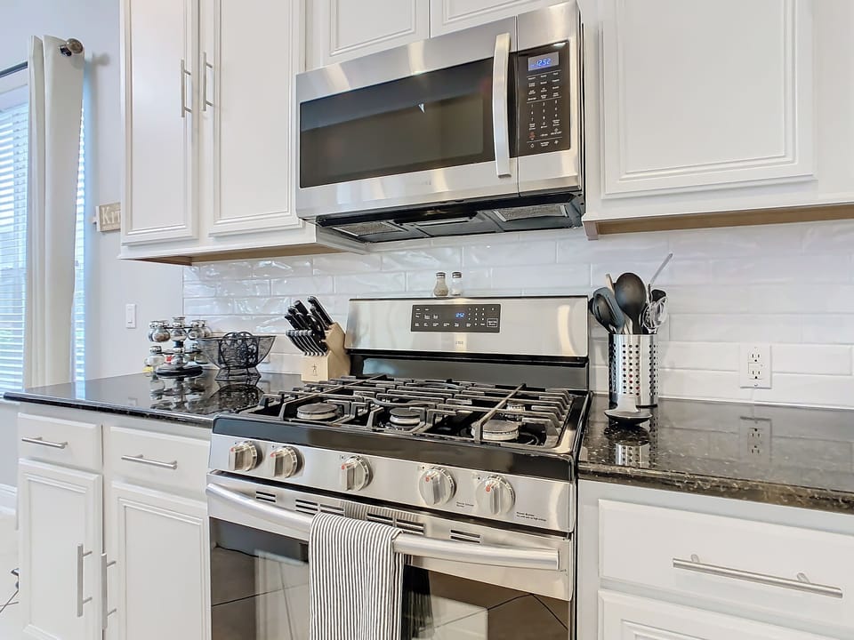 modern stove and microwave - cooking utensils - we accommodate longer stays.