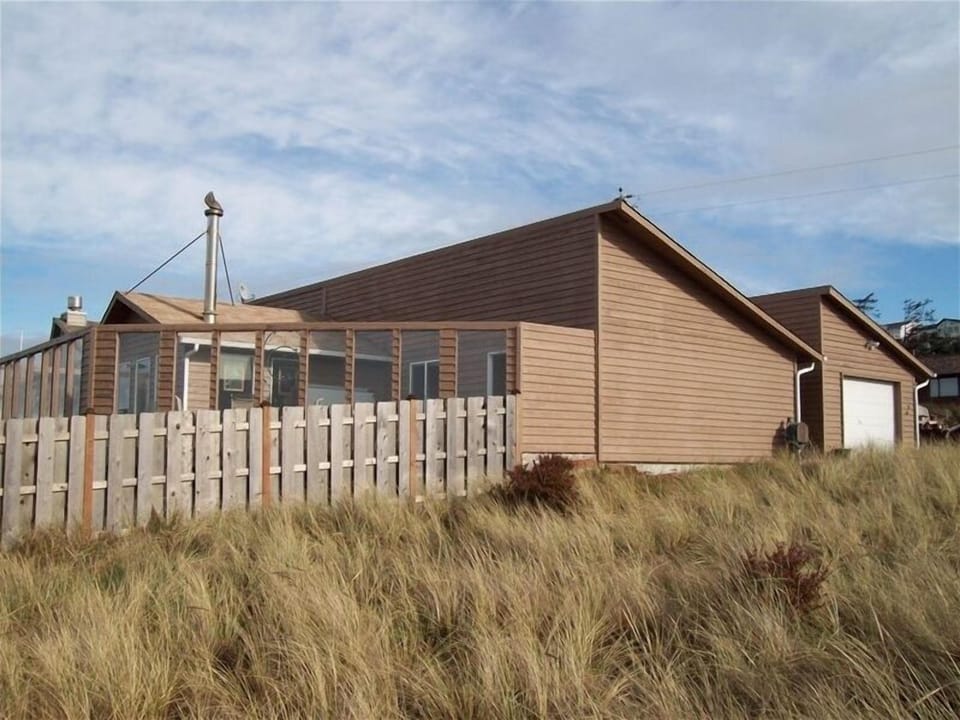 exterior view - fully fenced back yard and glassed in private ocean view deck