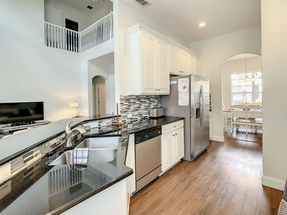 Open kitchen to the living room space. Solid surface counter tops.