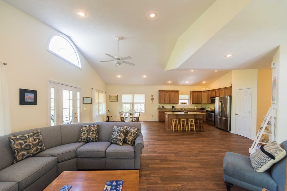 The Great Room with 12.5 foot vaulted ceilings and lots of windows