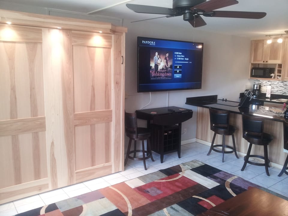 Unheard of custom made hickory 'KING' murphy wall bed allows for two sleeping areas. 