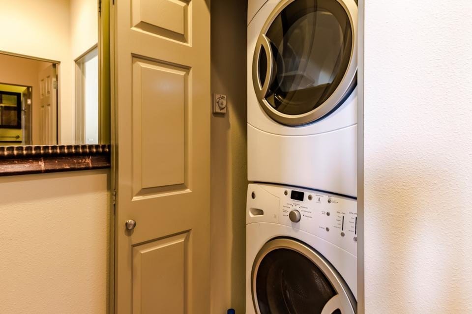 At the top of the stairs from the living room is washer/dryer