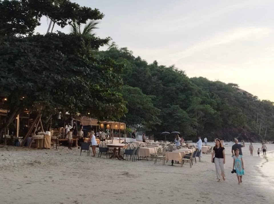 Beach nearby, white sand, sun loungers, beach umbrellas