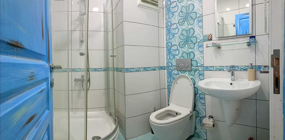 Shower, free toiletries, hair dryer, slippers