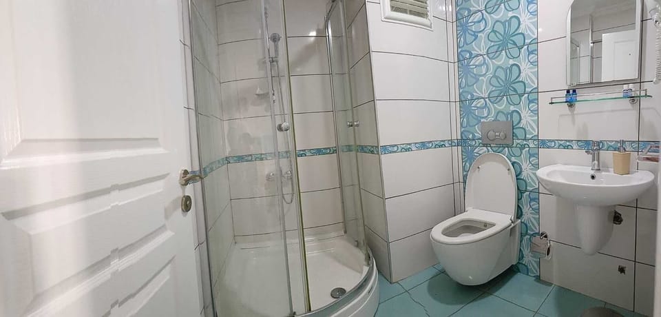 Shower, free toiletries, hair dryer, slippers