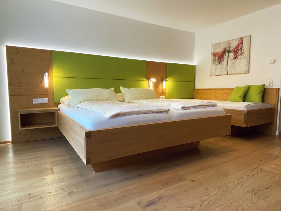 Family Room, Balcony (3 people) | Premium bedding, down comforters, individually decorated, desk