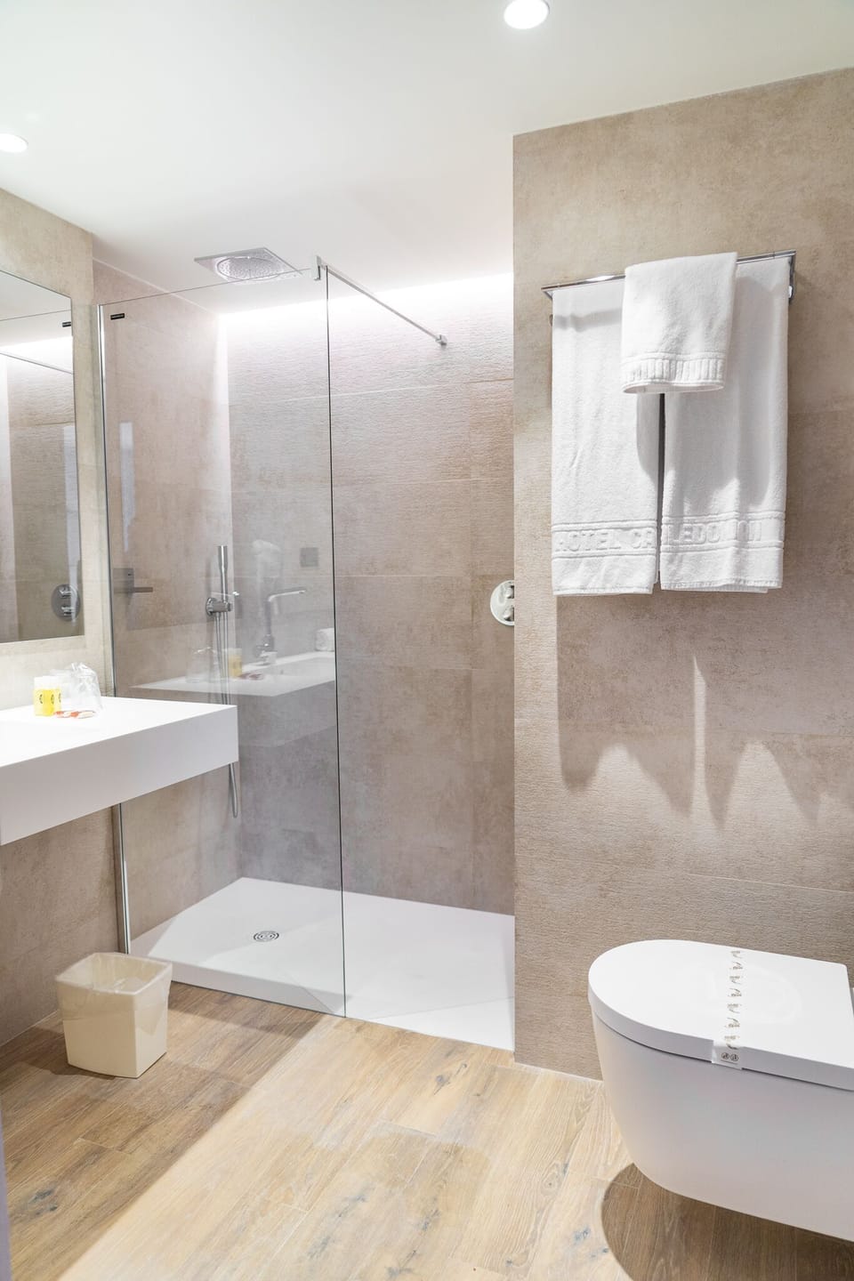 Shower, rainfall showerhead, hair dryer, towels