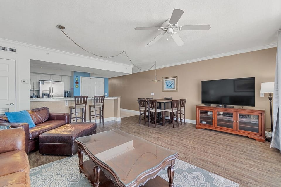 60” smart tv, & furnishings include a queen sleeper sofa and twin sleep chair. 