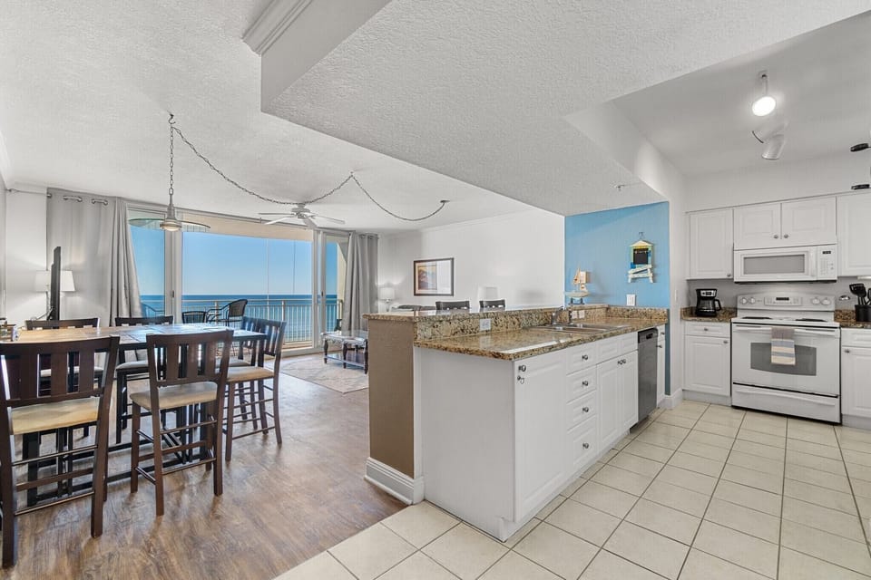 Large open floorplan with fully equipped kitchen and view out to ocean!