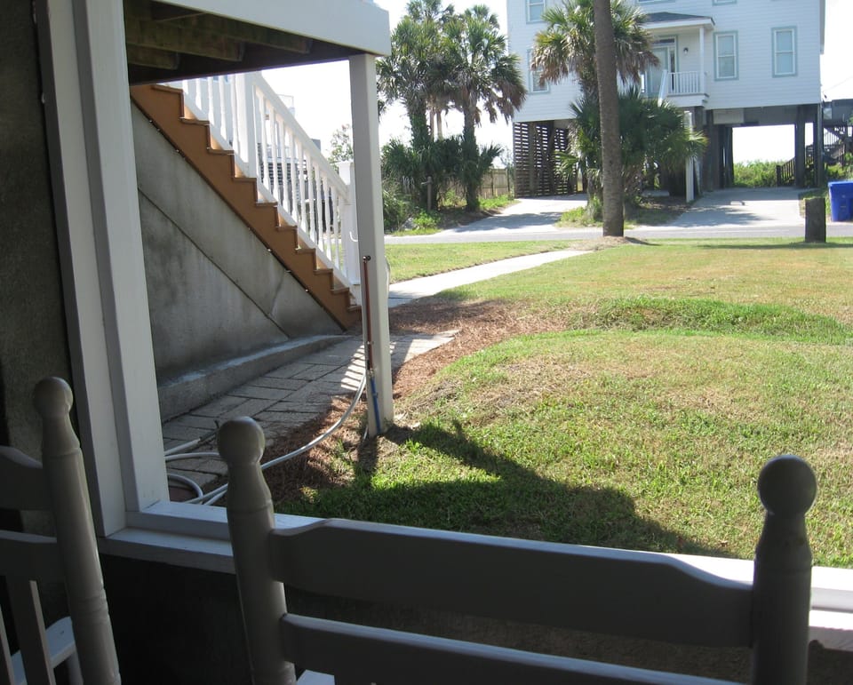Your view as you sit and watch the world go by.  Beach is only steps away.