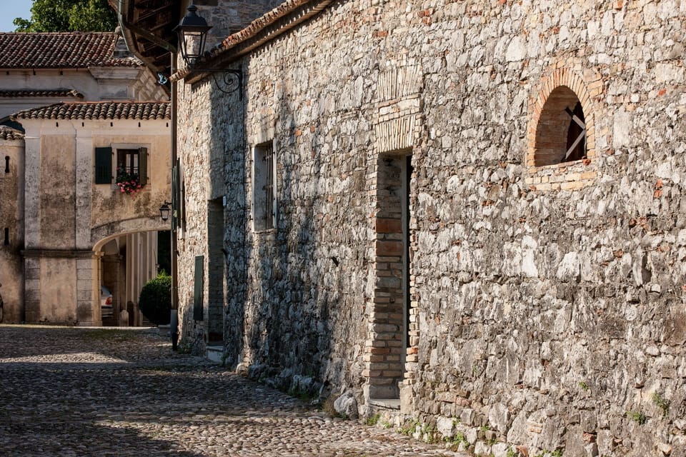Castle complex houses on cobbled road side