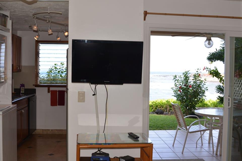 Step in the front door and view to kitchen, lanai and ocean.. 
