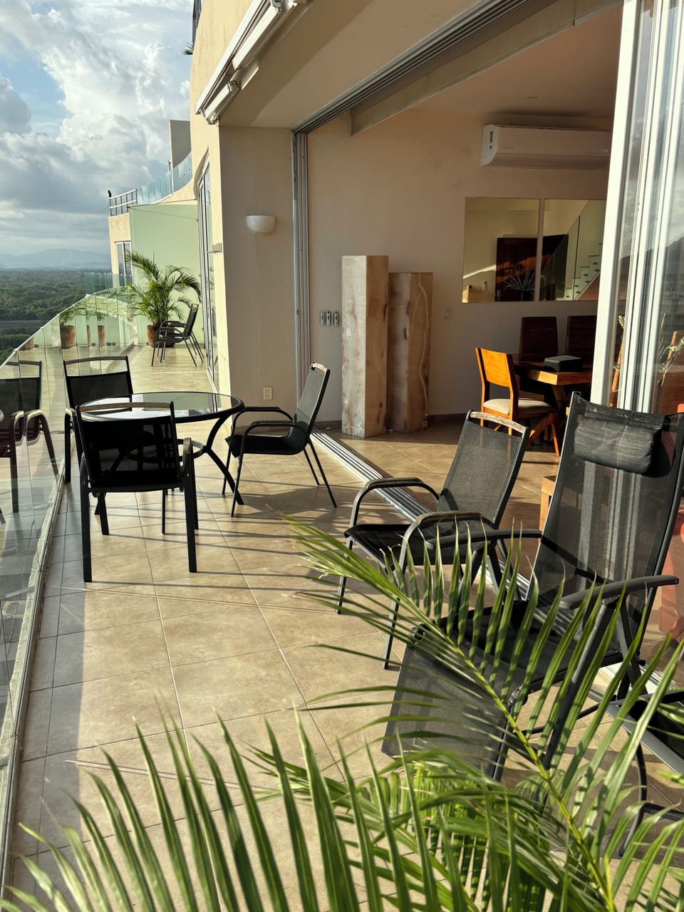 Spacious terrace running the length of the condo bringing the outside in.