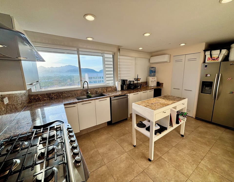 Expanded kitchen with island equipped with everything you need.