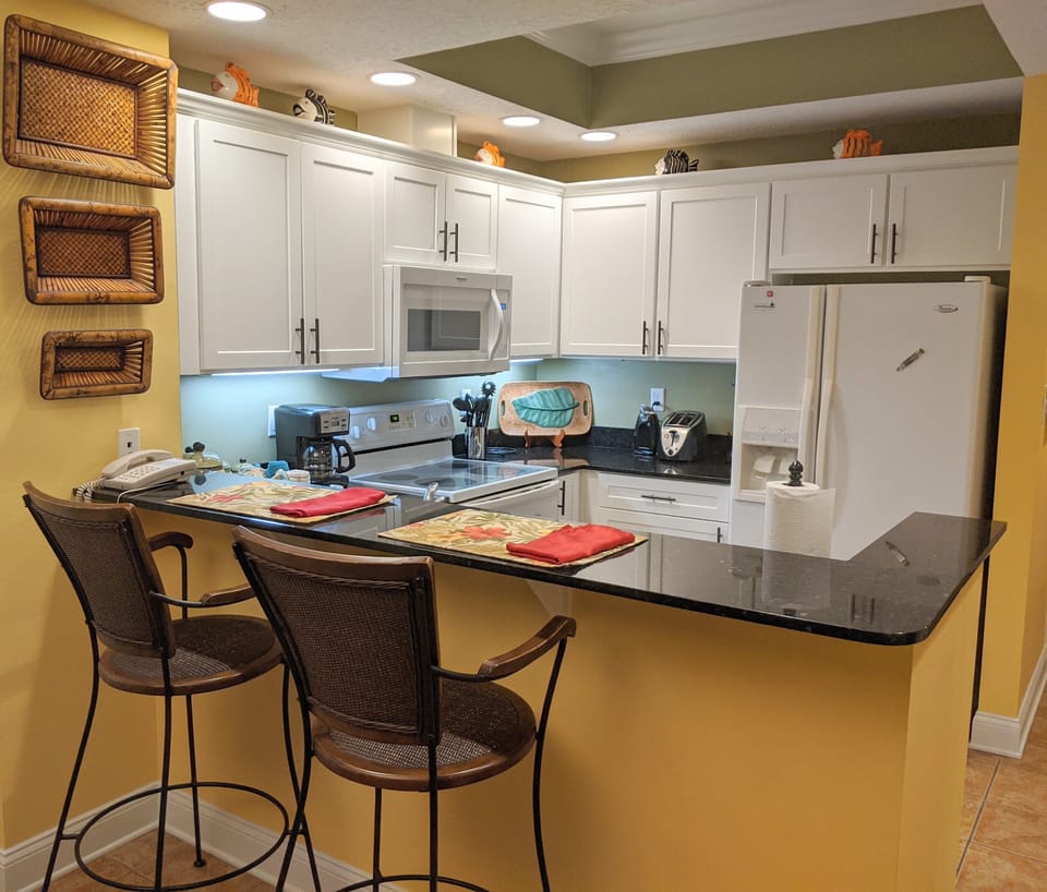 Fully equipped kitchen has both regular drip and pod coffee makers.