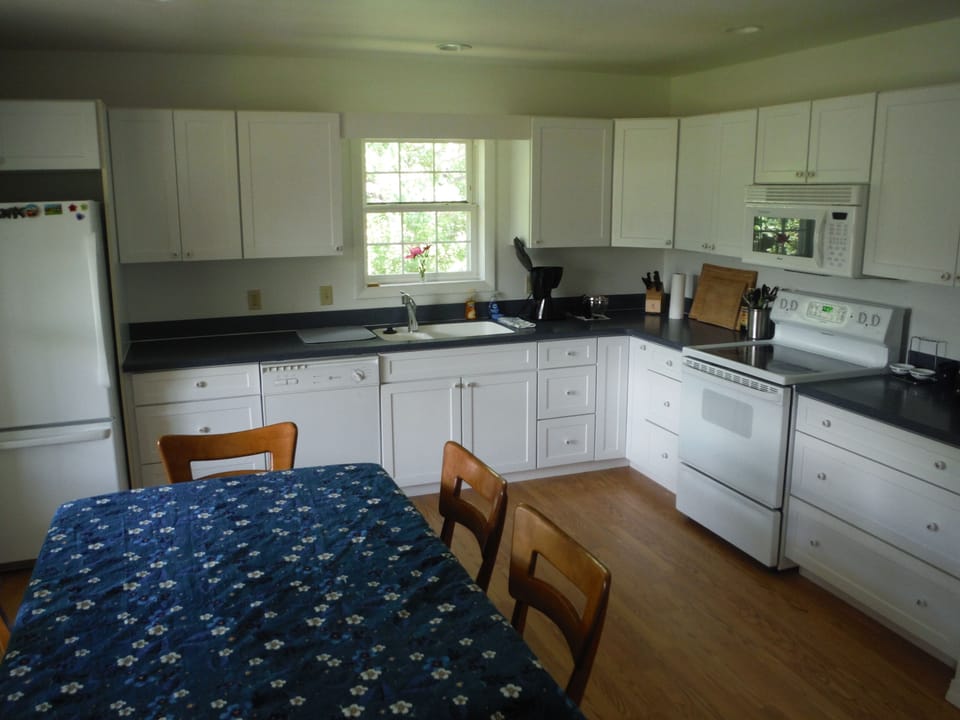 Enter the large kitchen with ample counter space and lots of natural light
